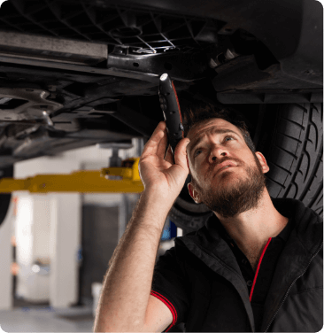 mechanic inspecting car for car repair